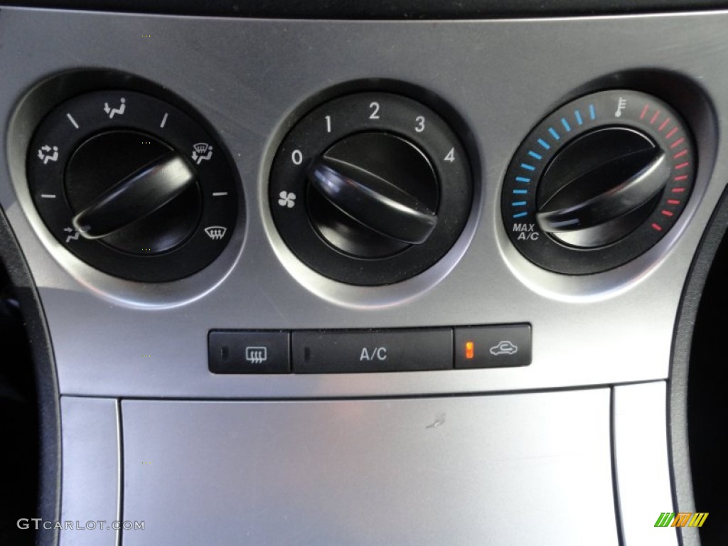 2010 MAZDA3 i Touring 4 Door - Black Mica / Black photo #26