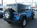 2010 Surf Blue Pearl Jeep Wrangler Unlimited Islander Edition 4x4  photo #4