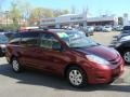 2009 Salsa Red Pearl Toyota Sienna LE  photo #1