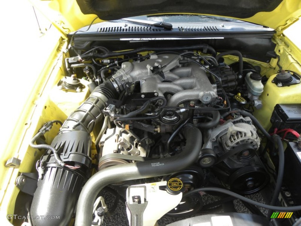 2002 Mustang V6 Coupe - Zinc Yellow / Medium Graphite photo #15