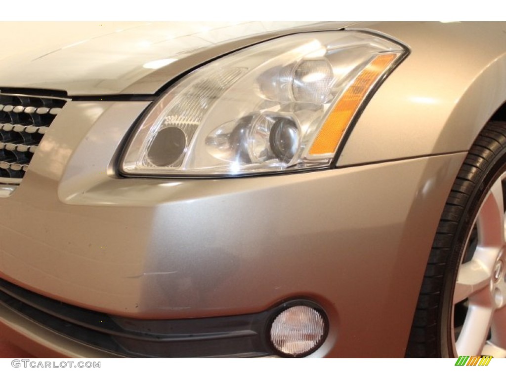 2004 Maxima 3.5 SE - Spirited Bronze / Black photo #22
