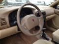 Medium Tan Steering Wheel Photo for 2000 Saturn L Series #64371179