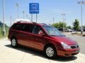 2011 Claret Red Kia Sedona LX  photo #2