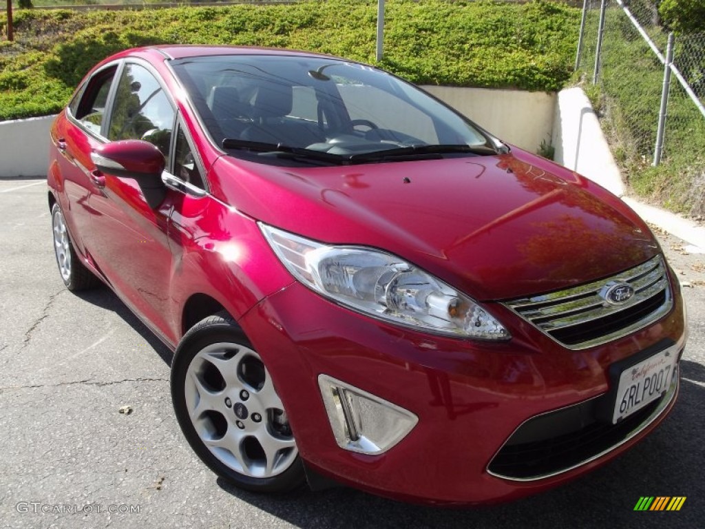 2011 Fiesta SEL Sedan - Bright Magenta Metallic / Charcoal Black Leather photo #1