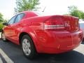 2009 Tor Red Dodge Avenger SE  photo #2