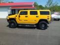 Yellow 2004 Hummer H2 SUV