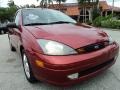 2004 Sangria Red Metallic Ford Focus ZX5 Hatchback  photo #2