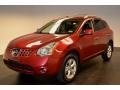 2010 Venom Red Nissan Rogue SL  photo #1
