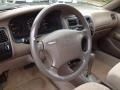 Beige 1997 Toyota Corolla DX Steering Wheel