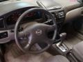 Taupe 2004 Nissan Sentra 1.8 S Steering Wheel