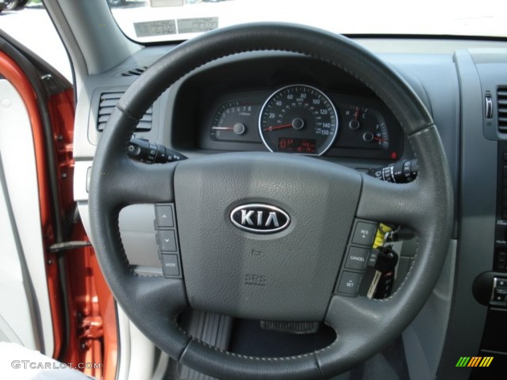 2009 Kia Borrego LX V6 4x4 Beige Steering Wheel Photo #65516114