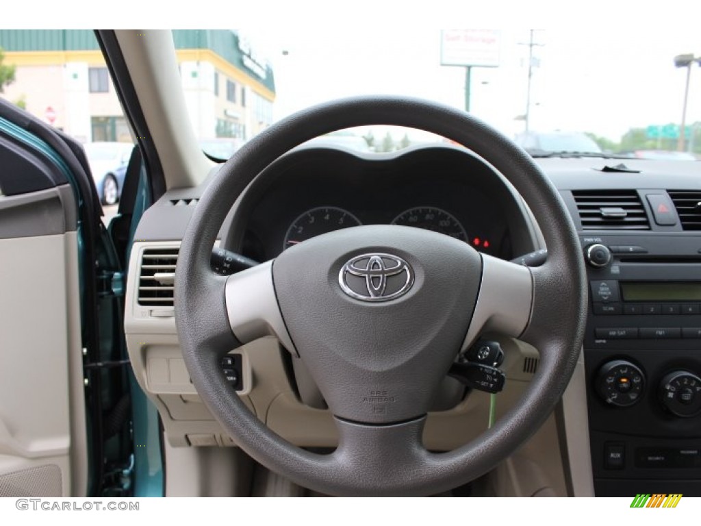 2010 Toyota Corolla LE Bisque Steering Wheel Photo #65685642