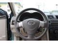 Bisque 2010 Toyota Corolla LE Steering Wheel