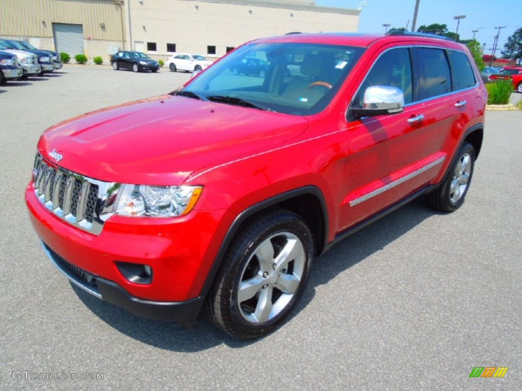 2011 Grand Cherokee Overland - Inferno Red Crystal Pearl / New Saddle/Black photo #1