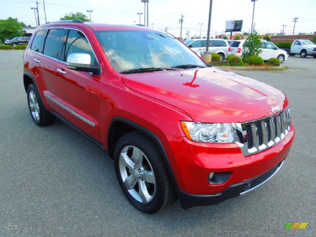 2011 Grand Cherokee Overland - Inferno Red Crystal Pearl / New Saddle/Black photo #2