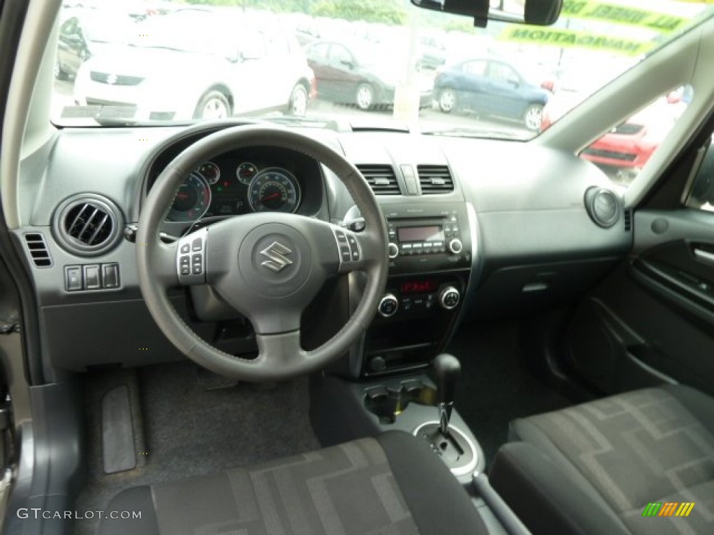 2010 Suzuki SX4 Crossover Touring AWD Black Dashboard Photo #65909005