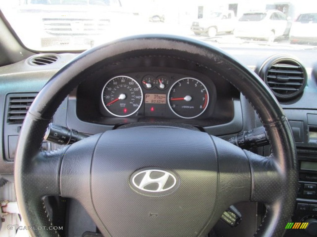 2003 Hyundai Tiburon GT V6 Black Steering Wheel Photo #65925752