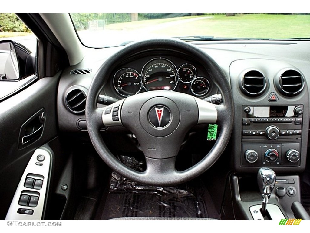 2010 Pontiac G6 Sedan Ebony Dashboard Photo #66144308