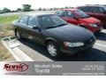 Black - Camry LE Photo No. 1