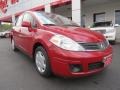 2009 Red Alert Nissan Versa 1.8 SL Sedan  photo #1