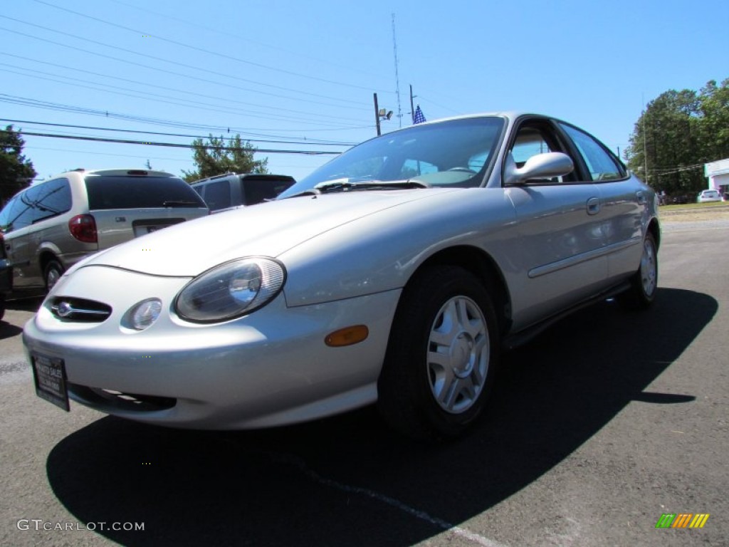 Silver Frost Metallic Ford Taurus