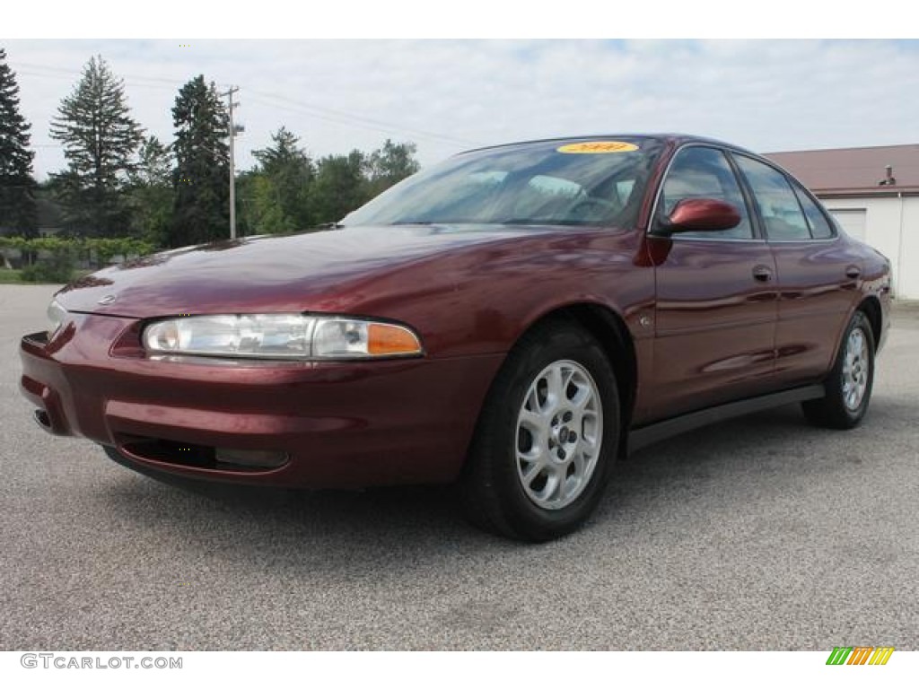 Ruby Red Metallic 2000 Oldsmobile Intrigue GL Exterior Photo #66936159