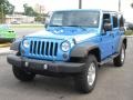 2010 Surf Blue Pearl Jeep Wrangler Unlimited Islander Edition 4x4  photo #13