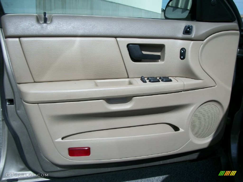 2006 Ford Taurus SE Medium/Dark Pebble Beige Door Panel Photo #67469560