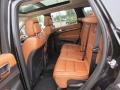 2012 Jeep Grand Cherokee New Saddle/Black Interior Rear Seat Photo