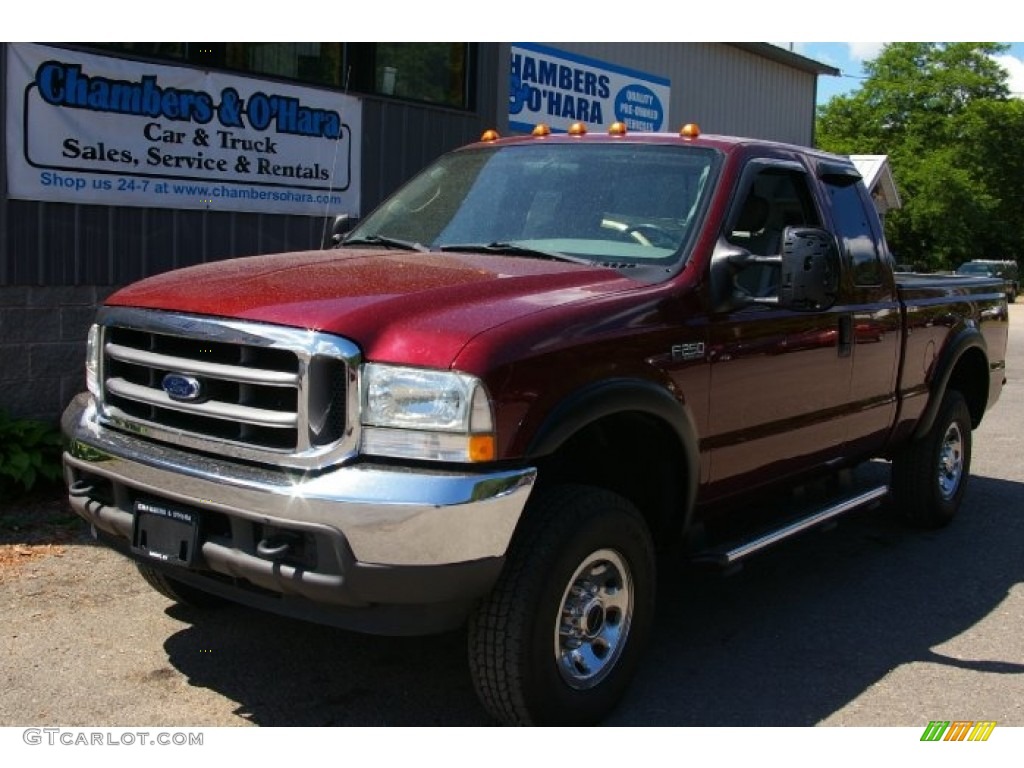 2004 F250 Super Duty XLT SuperCab 4x4 - Dark Toreador Red Metallic / Medium Flint photo #1