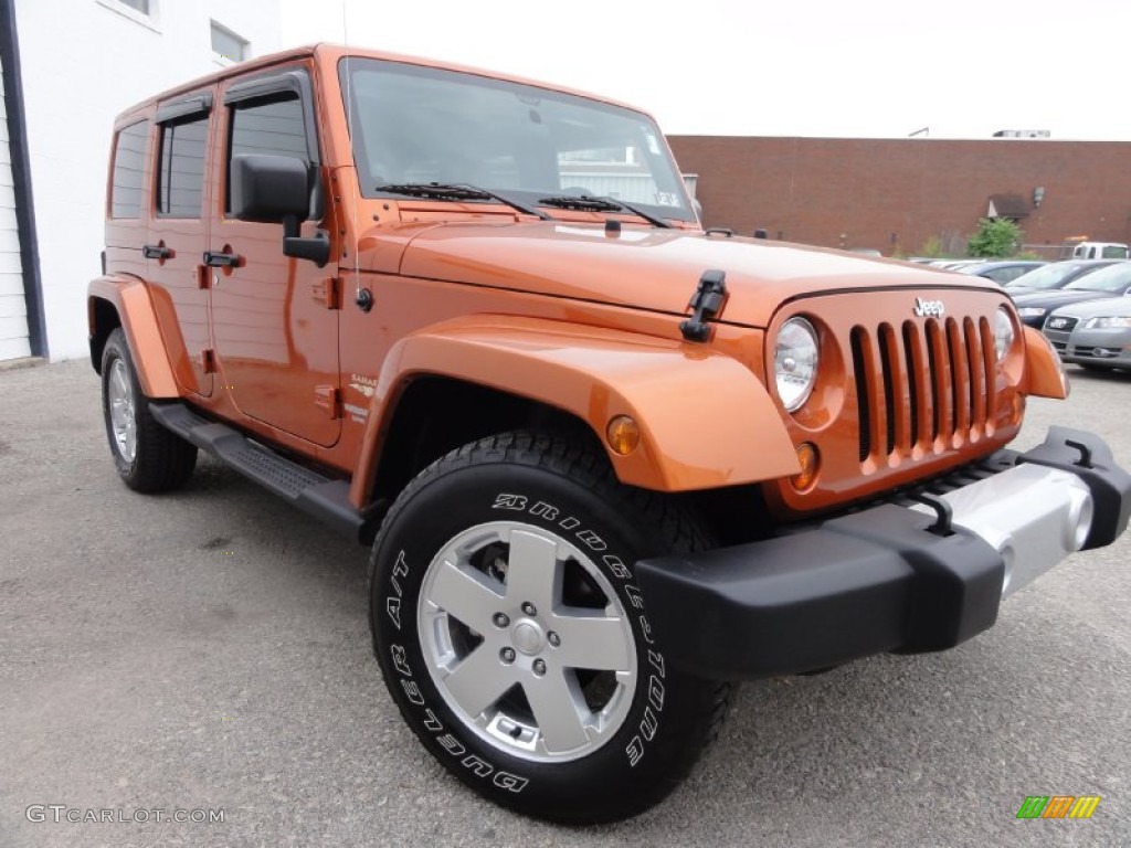 Mango Tango Pearl 2011 Jeep Wrangler Unlimited Sahara 4x4 Exterior Photo #68269136