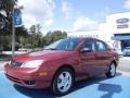 2005 Sangria Red Metallic Ford Focus ZX4 SES Sedan  photo #1