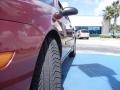 2005 Sangria Red Metallic Ford Focus ZX4 SES Sedan  photo #11