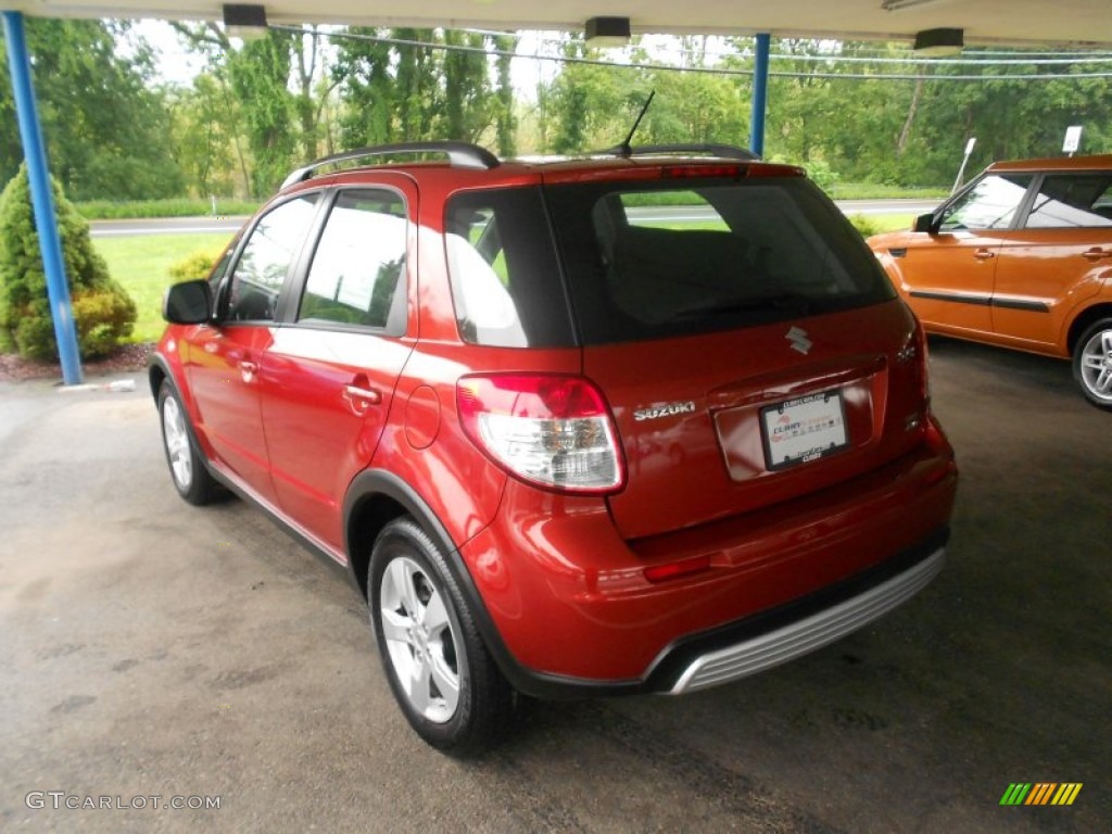 2011 SX4 Crossover Touring AWD - Cherry Red Metallic / Black photo #2