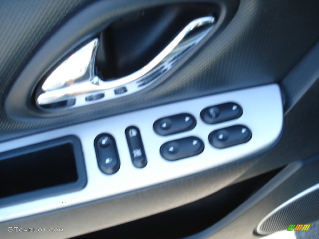 2007 Mariner Luxury 4WD - Light Tundra Metallic / Black photo #18