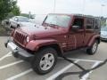 2009 Red Rock Crystal Pearl Jeep Wrangler Unlimited Sahara 4x4  photo #4