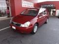 2012 Claret Red Kia Sedona LX  photo #1