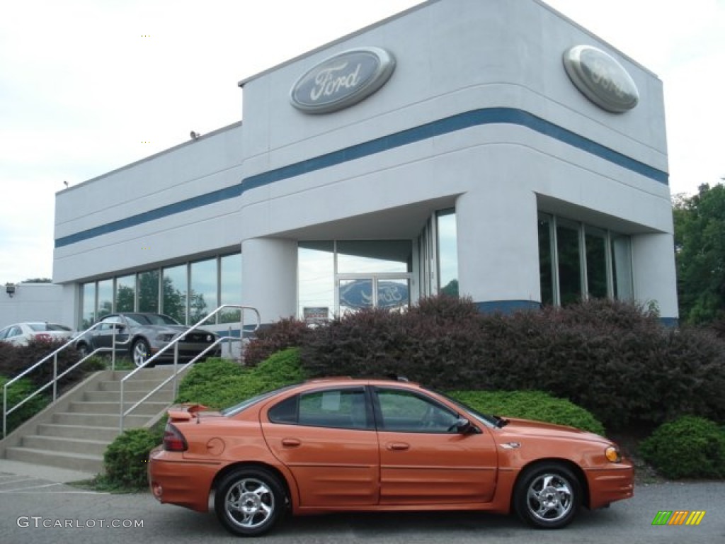 2004 Grand Am GT Sedan - Fusion Orange Metallic / Dark Pewter photo #1