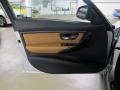 2012 BMW 3 Series Saddle Brown Interior Door Panel Photo