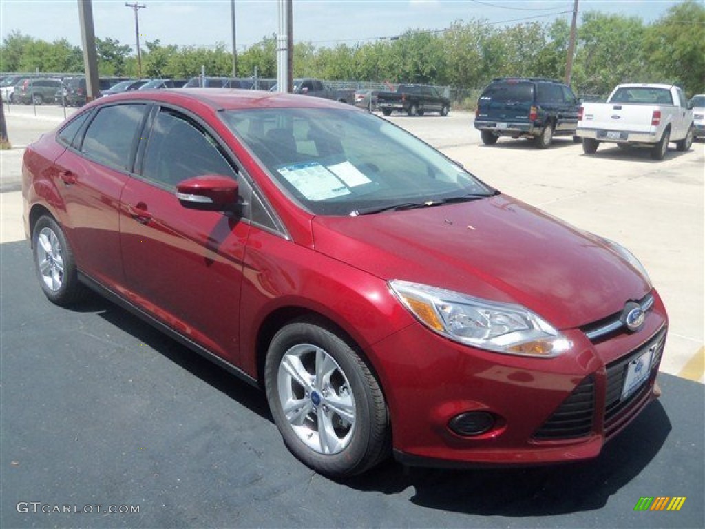 Ruby Red 2013 Ford Focus SE Sedan Exterior Photo #69478219