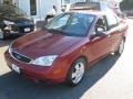 2005 Sangria Red Metallic Ford Focus ZX4 SES Sedan  photo #3