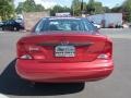 2004 Sangria Red Metallic Ford Focus LX Sedan  photo #6