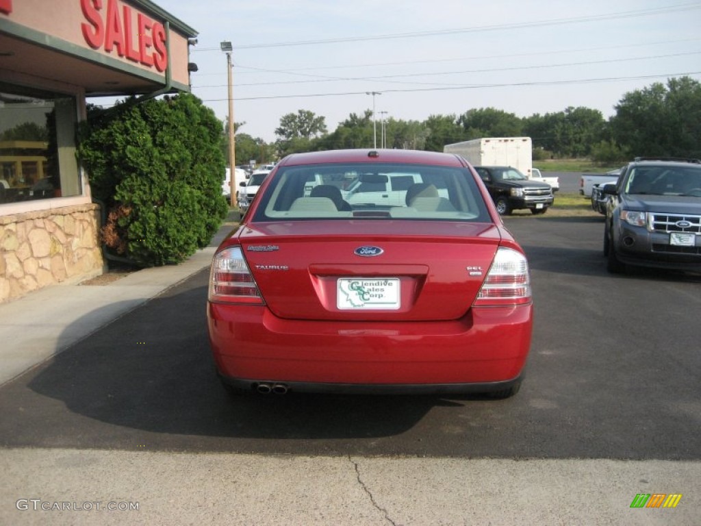 2009 Taurus SEL AWD - Sangria Red Metallic / Medium Light Stone photo #10