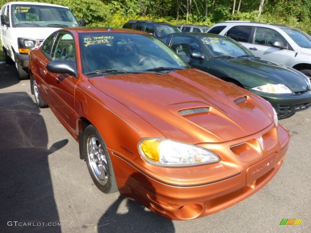 2004 Grand Am GT Sedan - Fusion Orange Metallic / Dark Pewter photo #1