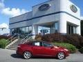 2013 Ruby Red Ford Focus SE Sedan  photo #1