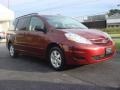 2010 Salsa Red Pearl Toyota Sienna LE  photo #1