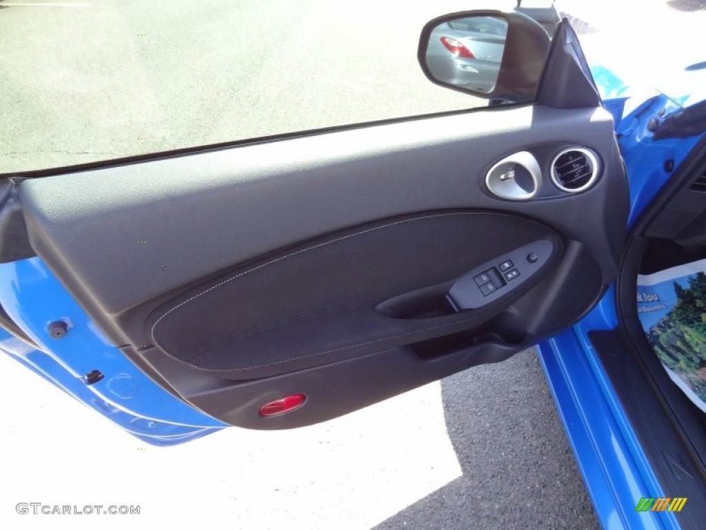 2010 Nissan 370Z Sport Coupe Black Cloth Door Panel Photo #71124020