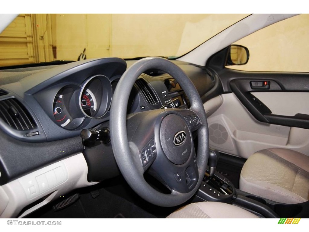 2010 Kia Forte EX Stone Steering Wheel Photo #71133096