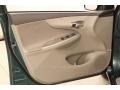 Bisque 2010 Toyota Corolla LE Door Panel