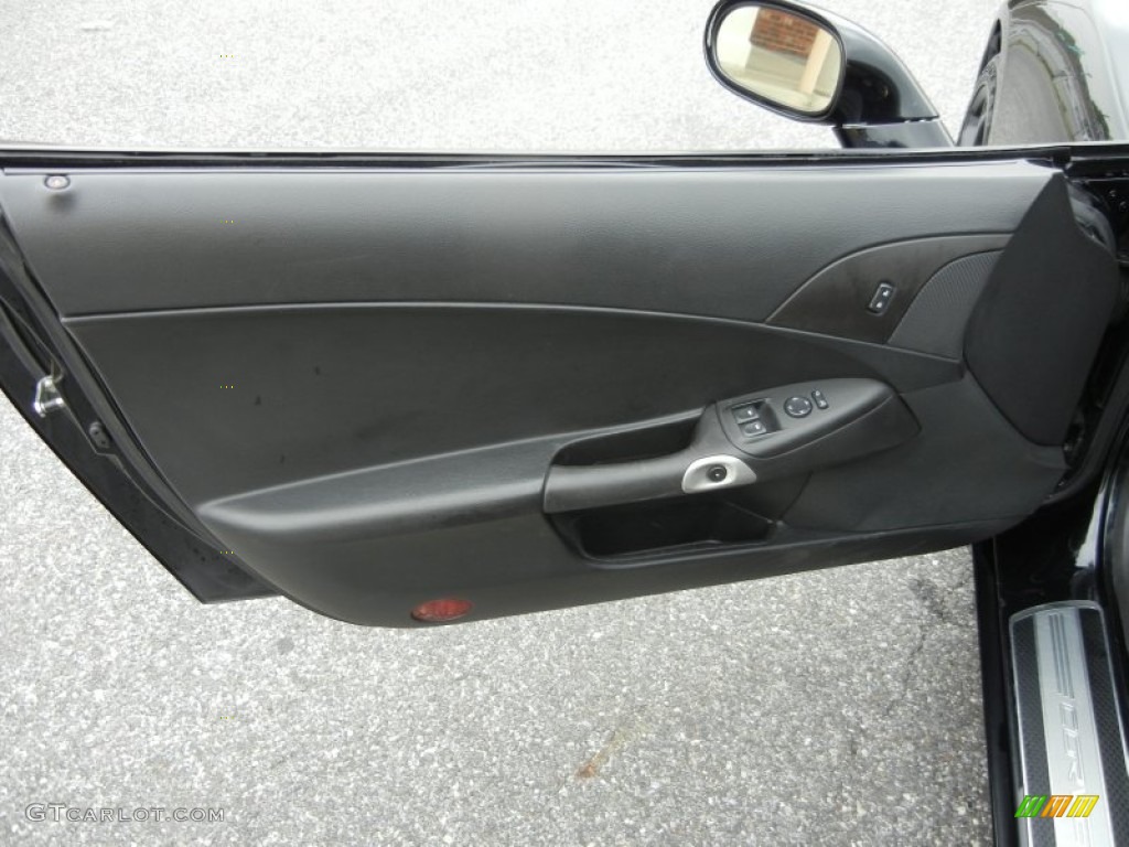 2009 Chevrolet Corvette Coupe Ebony Door Panel Photo #71848348